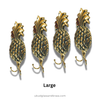 Four gold pineapple-shaped hooks on a white background