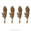 Four gold mermaid-shaped hooks on a white background with 'ubudglassandbrass.com' text.