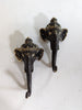Two Ganesha elephant head wall hooks with antique finishing mounted to the wall