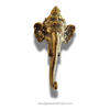 Decorative brass elephant head on a white background