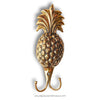 Gold pineapple-shaped hook on a white background