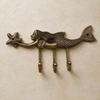 Antique finish brass mermaid wall hook with 3 fused hooks, showing the detailed mermaid tail engraving and coastal design.