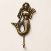 Antique finish brass mermaid wall hook with 3 fused hooks, showing the detailed mermaid tail engraving