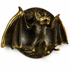 close up antique brass bat wall hook texture gothic decor vintage patina detail