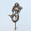 Antique finish brass starfish mermaid wall hook, showing the detailed mermaid engraving and coastal design.