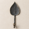 Antique bronze leaf wall hook front view, dark weathered finish coat and key hook