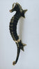 Single antique bronze seahorse door pull from the set, vertical view on grey background