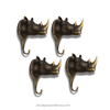 Antique finish set of 4 brass rhino wall hooks on white background, gothic safari wall storage