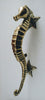 Antique bronze seahorse door handle shown individually, part of the matched door pull set
