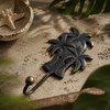 Close-up of brass palm tree wall hook matte black finish with tropical greenery showing detailed hand-cast triple palm tree sculpture and hook curve – palm tree coat hook key hook – dark boho beach house coastal tropical home decor – housewarming gift – handcrafted solid brass Bali
