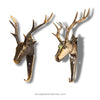 Two brass deer head wall hooks on a white background with 'ubudglassandbrass.com' text.
