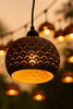 Boho garden string lights decorated with carved coconut patio light covers