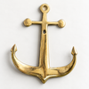 Brass anchor wall hook in a polished brass finish on a cream background, nautical coat hook and maritime wall decor