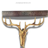 Gold deer head sculpture with a ruler for scale on a white background