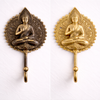 Brass Buddha wall hook in antique patina and polished gold finish for meditation and zen decor