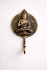 Front view of brass Buddha wall hook for meditation decor zen home and spiritual wall styling