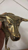 Close-up brass bull head wall hook showing sculpted bull face and handmade recycled brass texture
