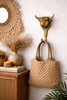 Brass bull head wall hook in boho entryway, wall hook for bag hanging and coat storage, handmade in Bali