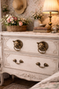Brass cat head ring pulls styled on a vintage dresser drawers for a cohesive set of 4 hardware look.