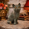 Brass cat sculpture styled on table, vintage brass cat figurine used as home accent decor