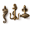 Brass coastal wall hook set with fish seahorse and anchor hooks for nautical bathroom decor