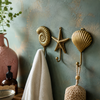 Handcrafted brass coastal wall hook set featuring a seashell, starfish, and ammonite shell design. Nautical wall decor perfect for beach house bathrooms, coastal homes, spa-inspired interiors, wabi sabi decor, ocean-themed entryways, towel storage, and new home gifts.