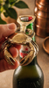 Brass crab beer bottle opener in lifestyle bar setting, gift for him, beer lover gift, man cave gift, and coastal home bar decor