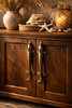 Brass dolphin pulls installed on cabinet doors, coastal nautical kitchen cabinet hardware set