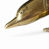 Close-up of gold brass dolphin door handle head detail, coastal door pull hardware