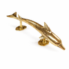Solid brass dolphin door handle in polished gold finish on white background