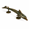 Green patina dolphin door handle shown on floor, nautical coastal decor door hardware finish option.