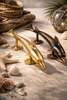 Gold and antique brass dolphin door handles styled with seashells, beach house coastal decor hardware