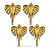Set of four brass elephant head wall hooks displayed together