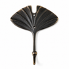 Dark antique brass fan leaf wall hook on white background showing full dark patina finish, intricate fan leaf vein detail and single hook arm. Handcrafted leaf shaped plant hanger hook, towel hook and coat hook for dark academia decor, boho home decor, housewarming gift and nature-inspired bathroom and entryway wall decor