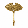 Gold brass fan leaf wall hook flat lay close-up on white background showing intricate fan leaf vein texture, warm gold brass finish and single mounting hole detail. Handcrafted leaf shaped plant hanger hook, towel hook and coat hook for boho home decor, housewarming gift, nature-inspired entryway decor and botanical wall decor