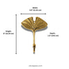 Brass fan leaf wall hook dimensions diagram showing width 4.5 inch (11.43 cm), height 6 inch (15.24 cm) and depth 1.5 inch (3.81 cm). Handcrafted gold and dark antique brass leaf shaped plant hanger hook, towel hook and coat hook for boho home decor, housewarming gift and nature-inspired bathroom and entryway wall decor