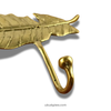 Close-up of brass feather hook detail on 3-hook wall rack, smooth rounded hooks for towels and coats