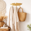 Brass feather wall hooks in a bathroom entry space, 3-hook rack for towels and robes with boho decor styling