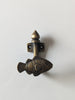 Front view of brass fish wall hook for coastal bathroom decor and ocean themed nursery wall