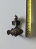 Brass fish wall hook next to measuring tape showing size for bathroom towel hook or nursery decor