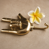 Brass hand gesture wall hook styled with a tropical flower, handmade rock and roll coat hook and funny gift.