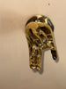 Alternate close-up of mounted brass hand wall hook with polished finish, bold novelty decor and functional hanging hook