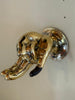 Side view of brass hand wall hook mounted to wall, sculptural hardware ideal for keys, robe, towel, or jewelry