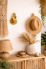 Boho entryway styling with brass hand wall hooks, set of 2 decorative mudra hands used as coat and key hooks above a console.