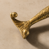 Side profile close-up of solid brass mermaid double wall hook showing two curved hooks extending from tail — brass mermaid drawer pull and door handle handmade in Bali