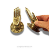 Brass hand sculpture door pull set shown in hand, mudra hand cabinet and drawer pull for pantry and closet doors