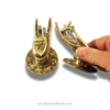 Brass mudra hand door pull pair shown in hand, Shuni and Abhaya styles for cabinet door pulls and drawers
