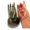 Patina brass mudra hand hook shown in hand for scale—sturdy decorative hardware for towels, robes, keys, or jewelry.