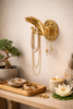 Brass mudra hand hook used as a jewelry holder in boho decor—functional wall hook for necklaces, keys, robes, and towels.