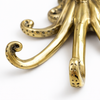 Close up of brass octopus wall hook tentacles in a polished gold finish